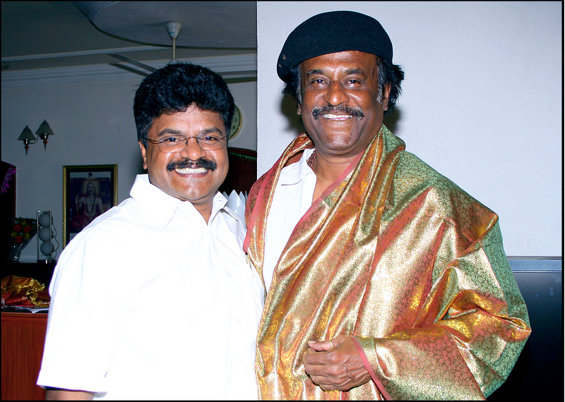Vedic Astrologer E.K. Dhilip Kumar alongside Superstar Rajinikanth